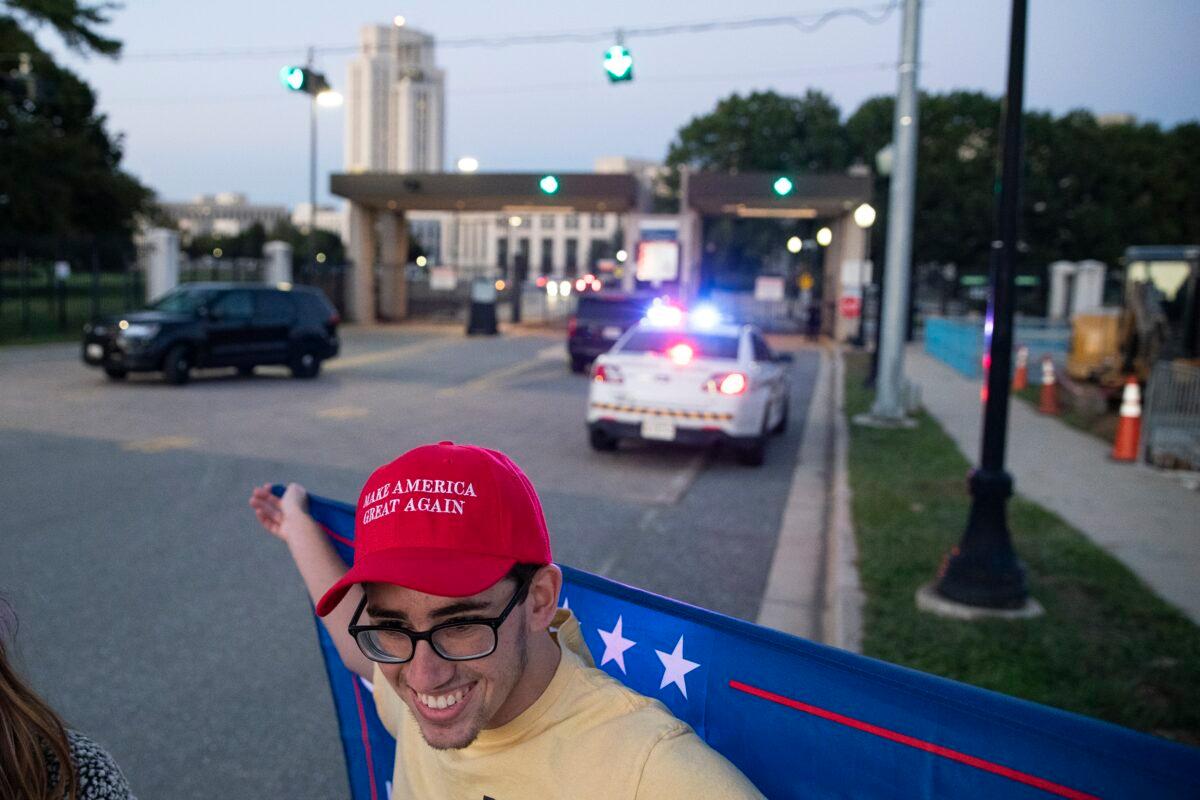 A supporter of President Donald Trump stands outside Walter Reed National Military Medical Center is seen in Bethesda, Md., on Oct. 2, 2020. (Alex Edelman/Getty Images)