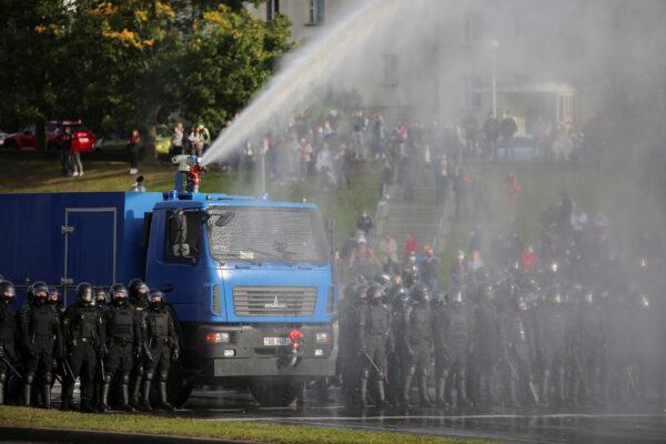 Police use a water cannon during an opposition rally to reject the presidential election results in Minsk, on Oct. 4, 2020. (Stringer/Reuters)