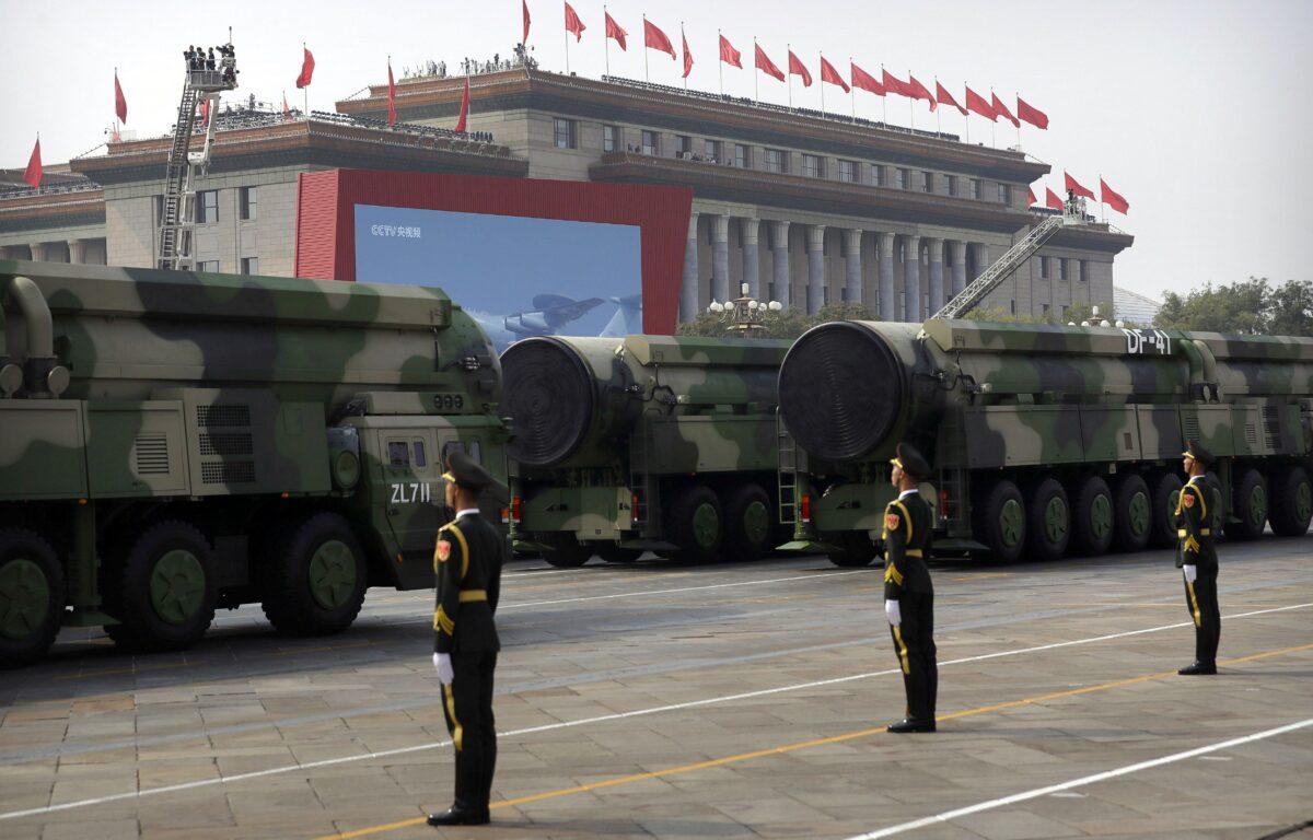 Chinese military vehicles carrying DF-41 ballistic missiles roll past the Great Hall of the People during a parade to commemorate the 70th anniversary of the founding of communist China in Beijing on Oct. 1, 2019. (Mark Schiefelbein/AP Photo)