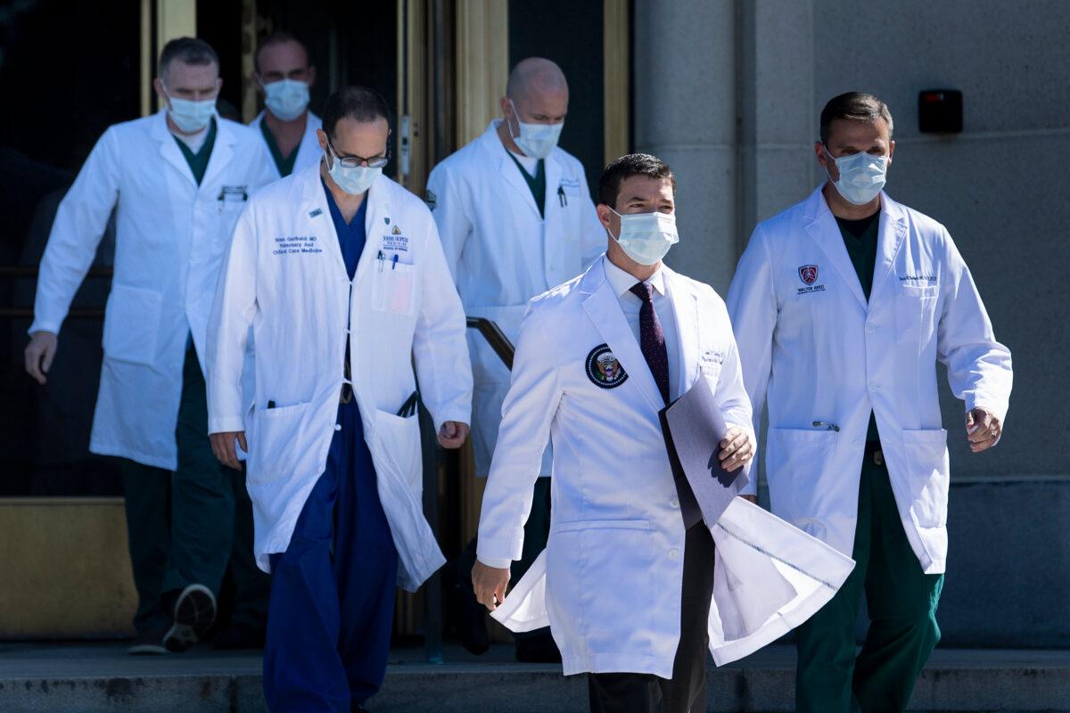 White House physician Sean Conley, second from right, with medical staff, arrives to give an update on the condition of President Donald Trump at Walter Reed Medical Center in Bethesda, Md., on Oct. 3, 2020. (Brendan Smialowski/AFP via Getty Images)