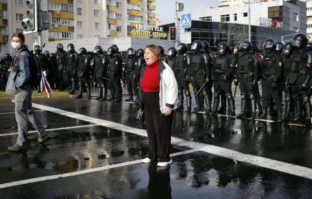 A protester shouts in front of a riot police line during a rally in Minsk, Belarus, on Oct. 4, 2020. (AP Photo)