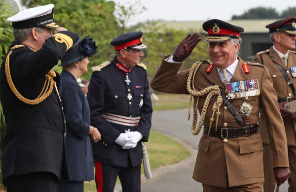 Britain's Chief of Defense Staff General Nick Carter (R) arrives to attend a national service of remembrance marking the 75th anniversary of VJ (Victory over Japan) Day at the National Memorial Arboretum in Alrewas, central England, on Aug. 15, 2020. (Peter Byrne/POOL/AFP via Getty Images)