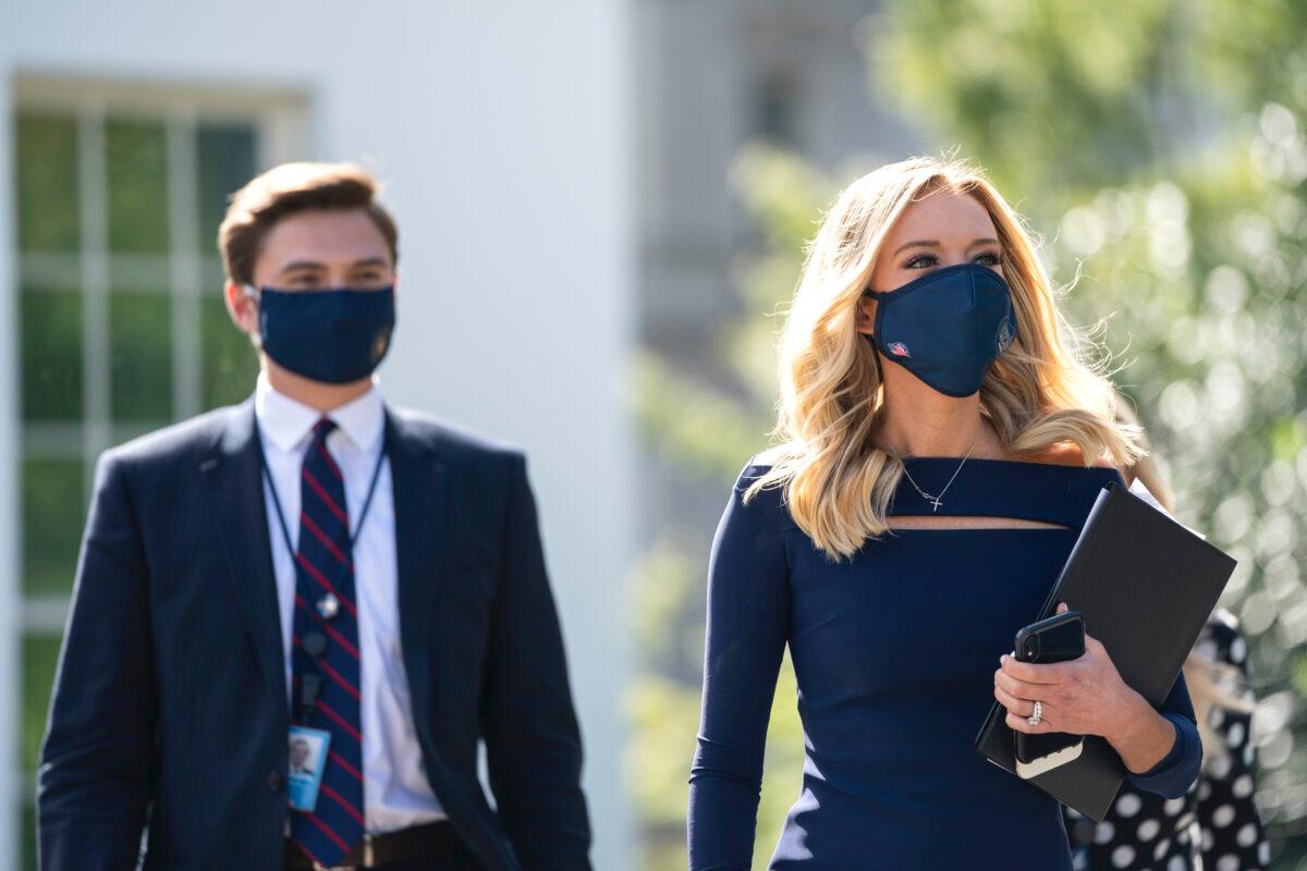 White House press secretary Kayleigh McEnany exits the West Wing on her way to do a television interview outside of the White House on Oct. 2, 2020. (Drew Angerer/Getty Images)