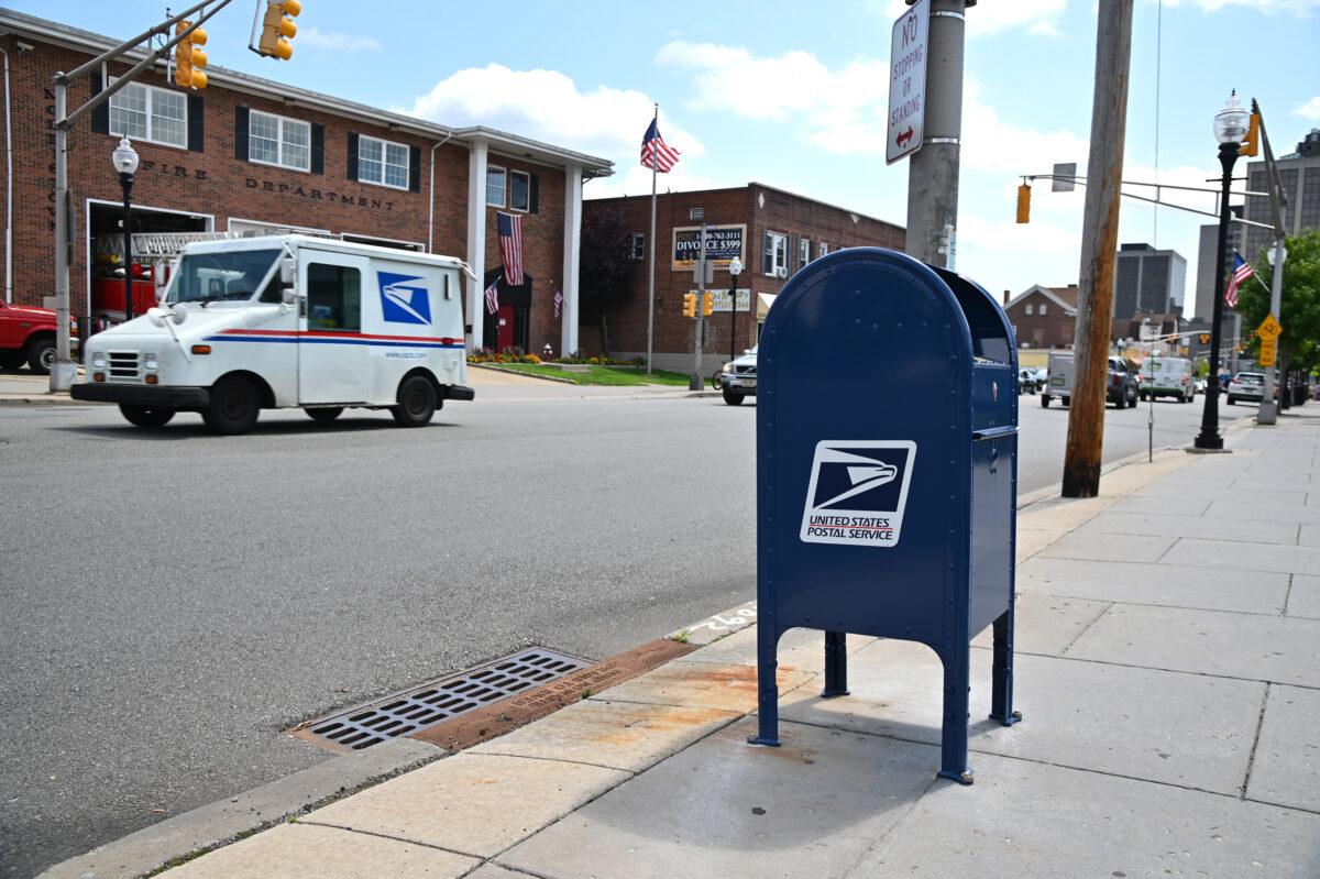 Cars drive past a mailbox in Morristown, N.J., on Aug. 17, 2020. (Theo Wargo/Getty Images)