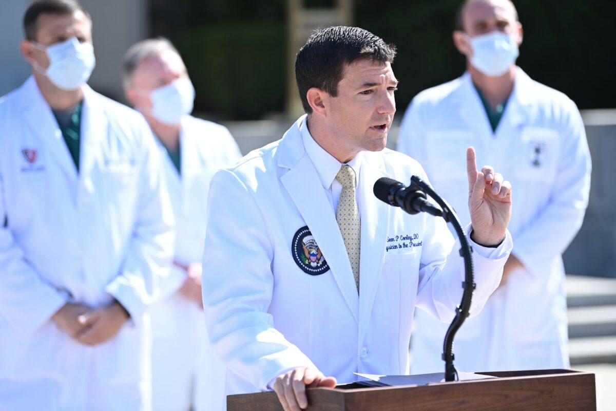 White House physician Sean Conley answers questions surrounded by other doctors, during an update on the condition of President Donald Trump, at Walter Reed Medical Center in Bethesda, Md., on Oct. 4, 2020. (Brendan Smialowski/AFP via Getty Images)