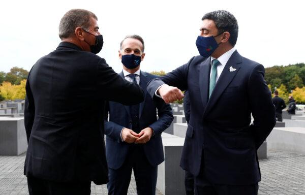 UAE Foreign Minister Sheikh Abdullah bin Zayed al-Nahyan and his Israeli counterpart Gabi Ashkenazi greet as they visit the Holocaust memorial together with German Foreign Minister Heiko Maas prior to their historic meeting in Berlin on Oct. 6, 2020. (Michele Tantussi/Reuters)