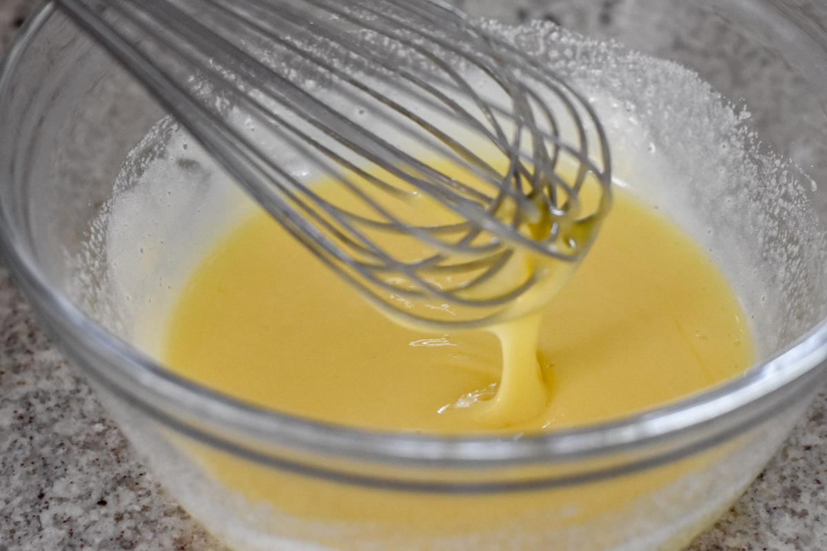 Whisk together the eggs and sugar until the mixture forms a ribbon. (Audrey Le Goff)