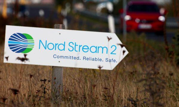 A road sign directs traffic towards the Nord Stream 2 gas line landfall facility entrance in Lubmin, Germany, on Sept. 10, 2020. (Hannibal Hanschke/Reuters)