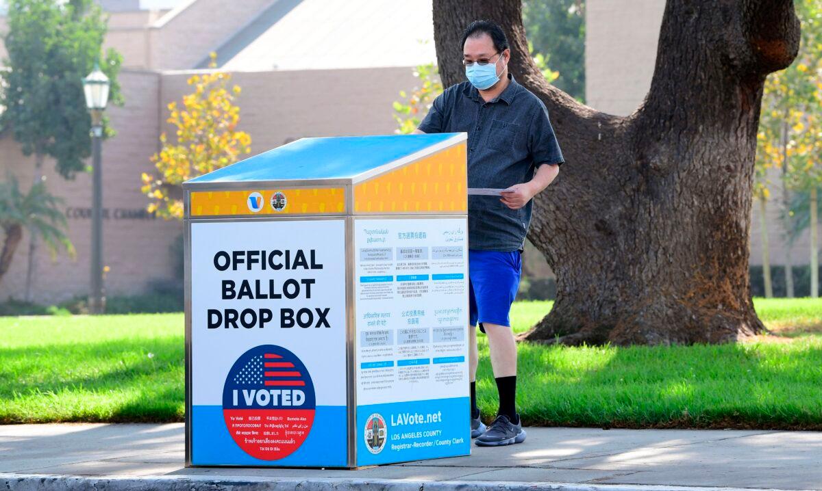 A ballot is dropped off at an official ballot dropbox in Monterey Park, Calif., on Oct. 5, 2020. (Frederic J. Brown/AFP via Getty Images)