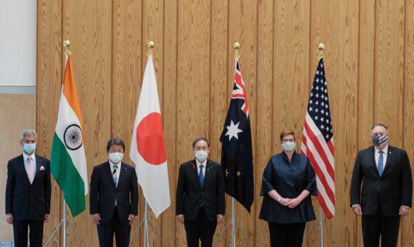 (L-R) India's Foreign Minister Subrahmanyam Jaishankar, Japan's Foreign Minister Toshimitsu Motegi, Japan's PM Yoshihide Suga, Australia's Foreign Minister Marise Payne, and U.S. Secretary of State Mike Pompeo pose for photographs before a Quad Indo-Pacific meeting at the prime minister's office in Tokyo on Oct. 6, 2020. (Nicolas Datiche/Pool/AFP via Getty Images)