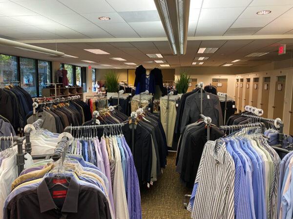  Donated suits and shirts line the racks inside the new Working Wardrobes location in Santa Ana, Calif., on Sept. 30, 2020. (Jack Bradley/The Epoch Times)