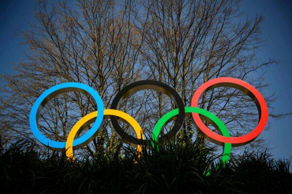 The Olympic Rings logo is pictured in front of the headquarters of the International Olympic Committee in Lausanne, Switzerland, on March 18, 2020. (Fabrice Coffrini /AFP via Getty Images)