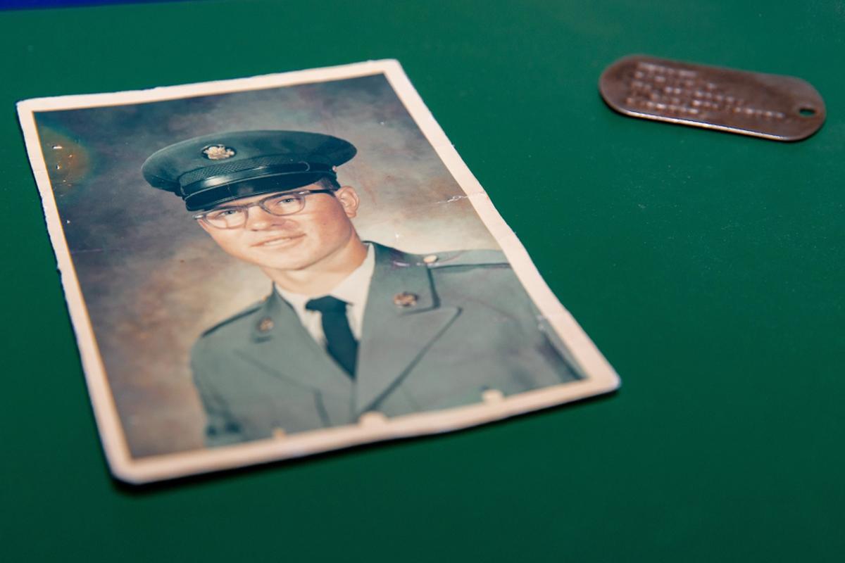 Ronald Hepper's ID tag is pictured with a photo of the Vietnam veteran and Purple Heart recipient. (Courtesy of North Dakota Office of the Governor)