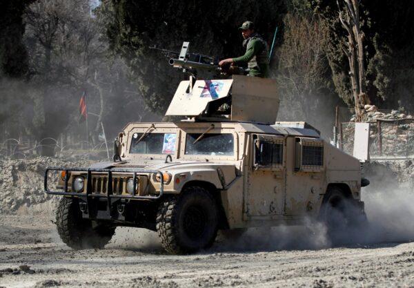 An armored vehicle patrols near the side of an incident where two U.S soldiers were killed a day before in Shirzad district of Nangarhar province, Afghanistan, on Feb. 9, 2020. (Parwiz/Reuters)