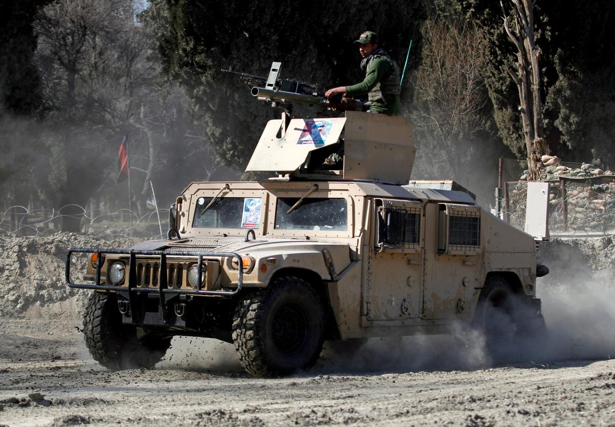 An armored vehicle patrols near the site of an incident in which two U.S. soldiers were killed a day before in Shirzad district of Nangarhar province, Afghanistan, on Feb. 9, 2020. (Parwiz/Reuters)