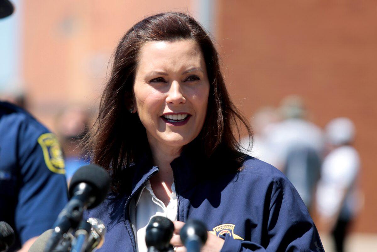 Michigan Gov. Gretchen Whitmer addresses the media about the flooding along the Tittabawassee River, after several dams breached, in downtown Midland, Mich., on May 20, 2020. (Rebecca Cook/Reuters)