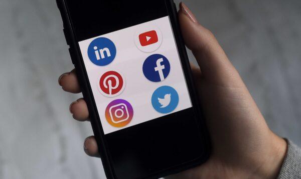 This illustration picture shows social media applications logos from Linkedin, YouTube, Pinterest, Facebook, Instagram, and Twitter displayed on a smartphone in Arlington, Va., on May 28, 2020. (Olivier Douliery/AFP via Getty Images)