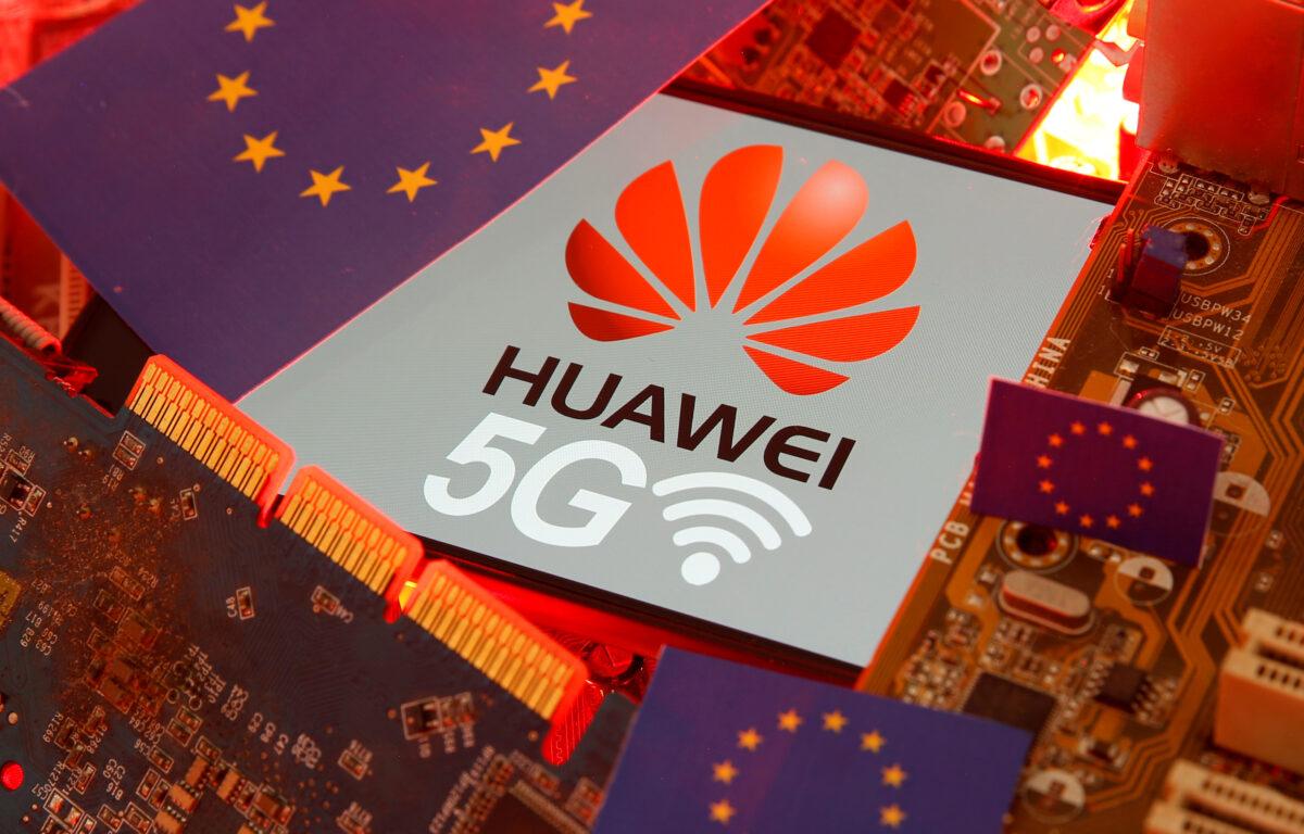 The EU flag and a smartphone with the Huawei and 5G network logo on a PC motherboard in this illustration taken on Jan. 29, 2020. (Dado Ruvic/Reuters)