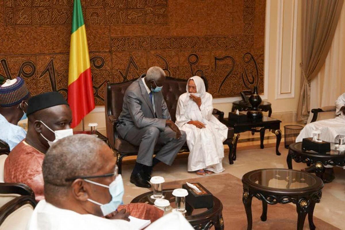French ex-hostage Sophie Petronin, center right, who had spent nearly four years in captivity, meets with transitional president Col. Maj. Bah N'Daw, center left, at the presidential palace after being released and flown to the capital Bamako, Mali, on Oct. 8, 2020. (Mali Presidency via AP)