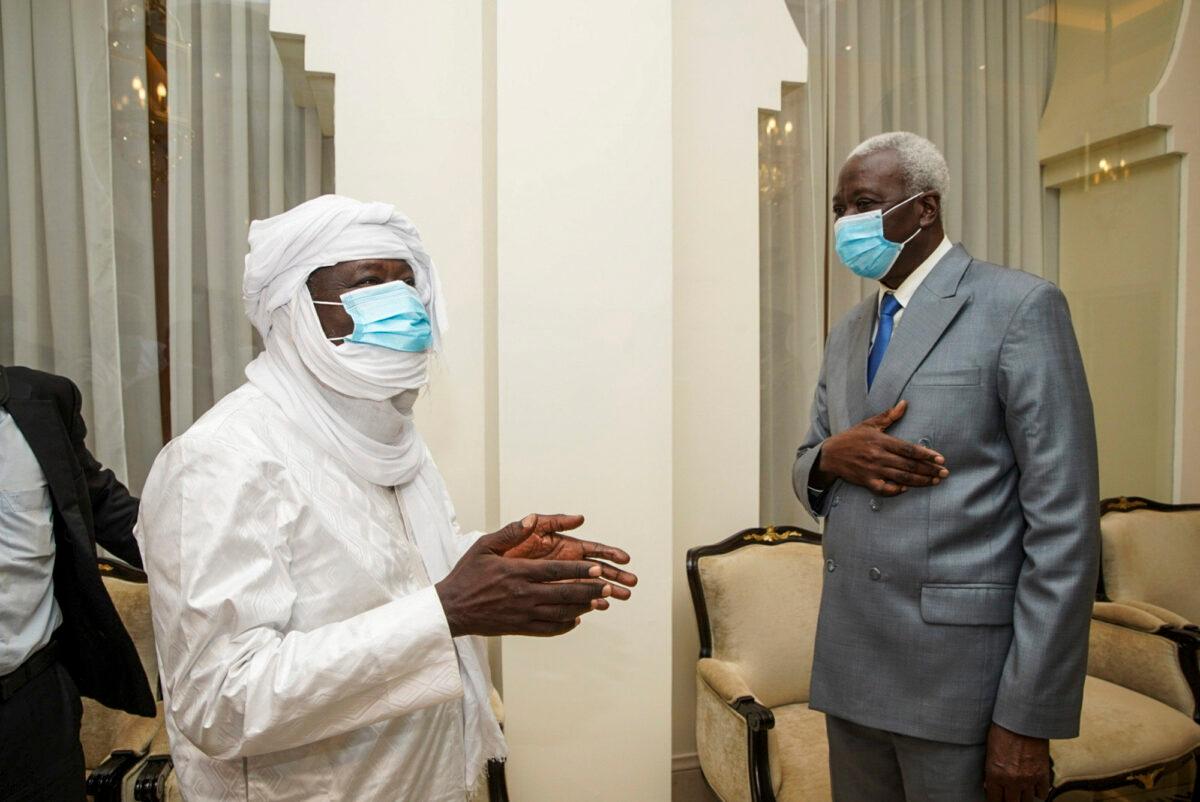 Three-time Malian presidential candidate and ex-hostage Soumaila Cisse (L), meets with transitional president Col. Maj. Bah N'Daw at the presidential palace after being released and flown to the capital Bamako, Mali, on Oct. 8, 2020. (Mali Presidency via AP)