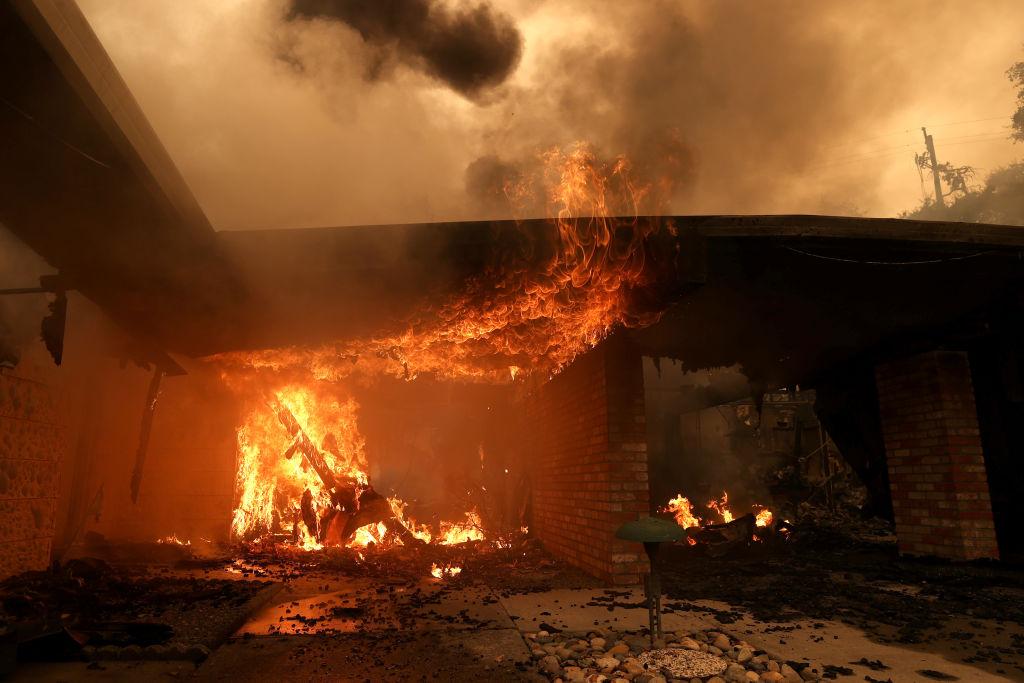 Flames ravage a home that was destroyed by the Glass Fire in Santa Rosa on Sept. 28, 2020. (Justin Sullivan/Getty Images)