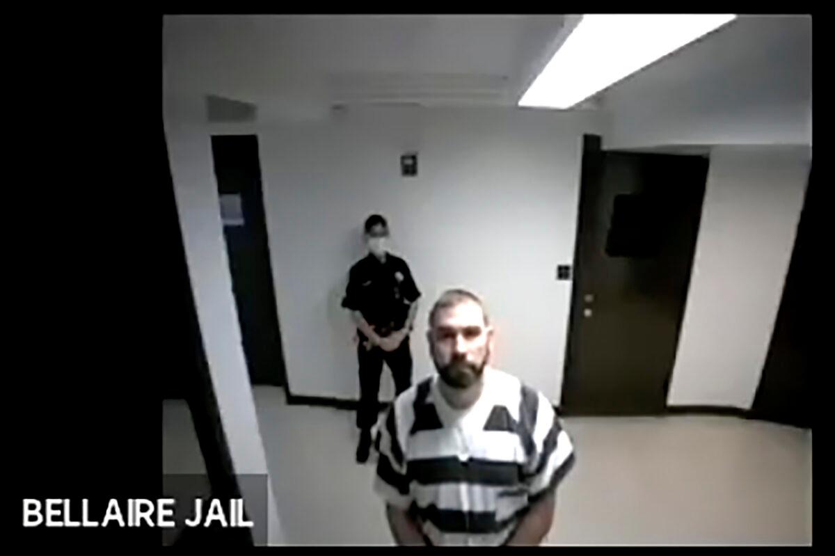In this screen grab from live stream video, Shawn Fix, a Wolverine Watchmen member or associate, appears from Bellaire County Jail during a virtual hearing at the Grand Traverse 86th District Court., in Traverse City, Mich., on Oct. 9, 2020. Fix is charged with terrorist acts and violating federal firearms laws. His attorney entered a not guilty plea on his behalf and bond was set at $250,000. (Grand Traverse 86th District Court via AP)