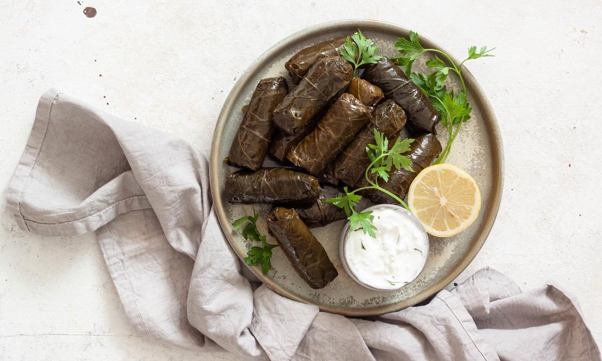 Hand-rolled dolmades, stuffed with herbed rice, are more time-consuming to prepare but highly rewarding to eat. (Von Viktoria Hodos)