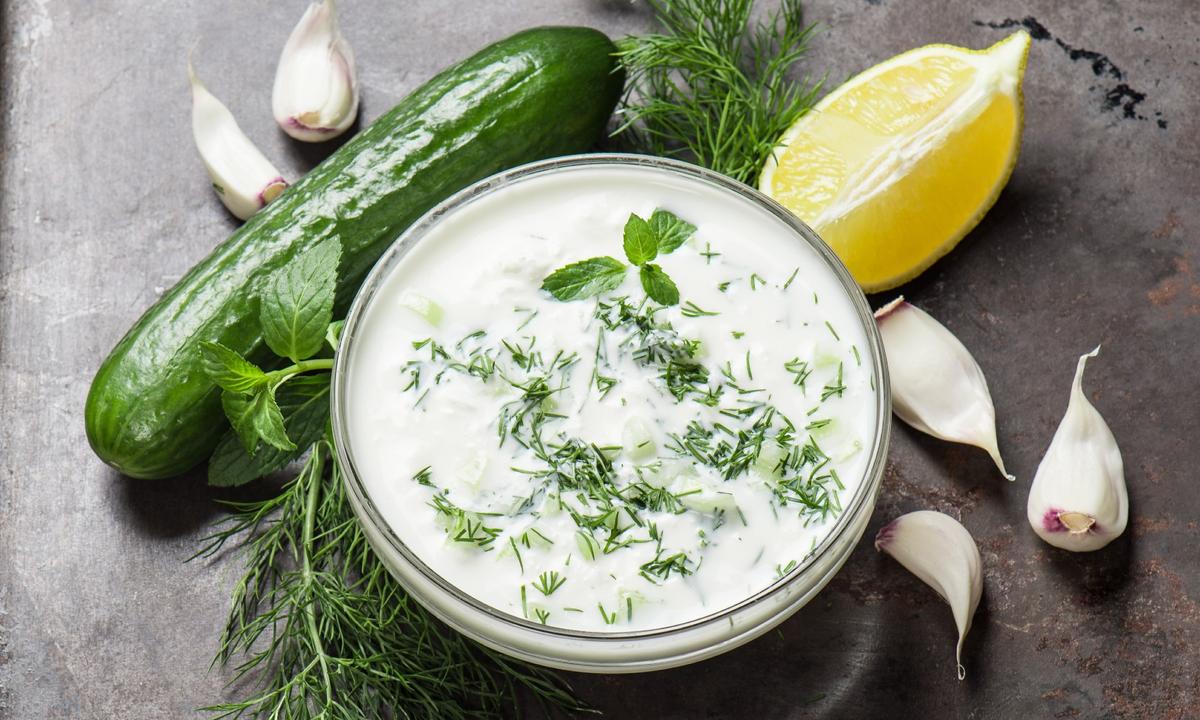 Creamy, cooling tzatziki, speckled with grated cucumber and dill, is one of the most iconic Greek starters. (LiliGraphie/Shutterstock)