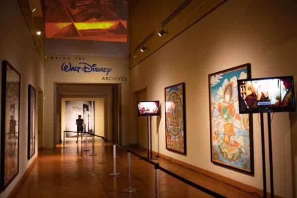 Visitors enjoy an exhibit showcasing the Walt Disney Archives at the Bowers Museum in Santa Ana, Calif., on June 30, 2020. (John Fredricks/The Epoch Times)