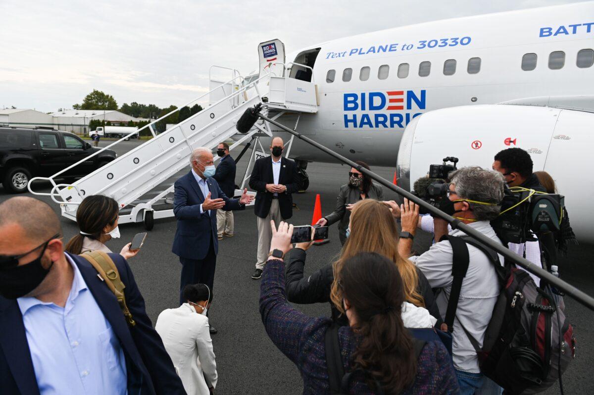 Democratic presidential candidate Joe Biden speaks to the press as he arrives at New Castle Airport in Wilmington, Del., on Oct. 10, 2020. (Roberto Schmidt/AFP via Getty Images)