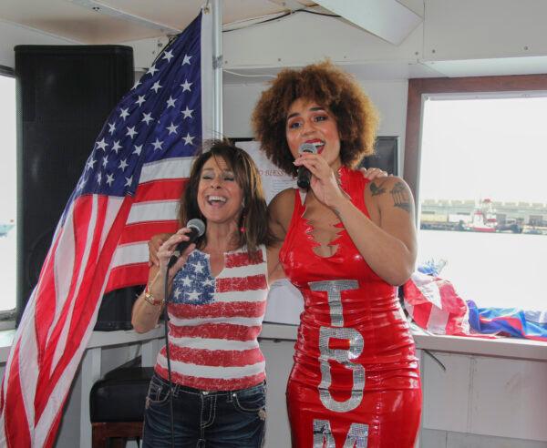 Diana Nagy (L) and Joy Villa (R) perform on the Trump Flagship boat during a boat parade to support President Donald Trump in San Francisco, on Oct. 10, 2020. (David Lam/The Epoch Times)
