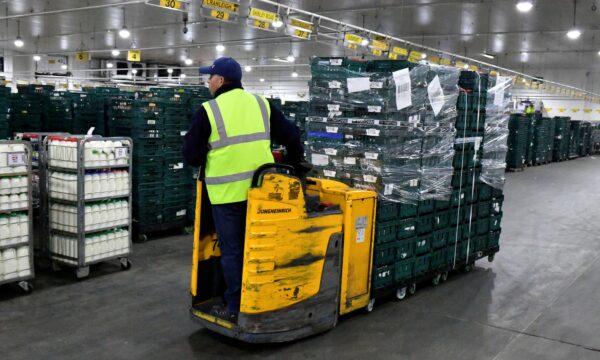 Marks & Spencer cold produce being transported to dispatch area via bladed fork lifts at Gist logistics depot, in Thatcham near Reading, Britain, on Oct. 9, 2020. (Beresford Hodge/Reuters)