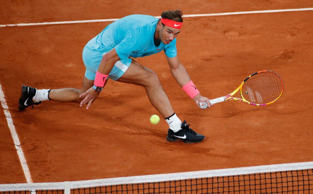 Spain’s Rafael Nadal plays a shot against Serbia's Novak Djokovic in the final match of the French Open tennis tournament at the Roland Garros stadium in Paris, on Oct. 11, 2020. (Christophe Ena/AP Photo)