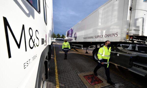 Staff observe COVID-19 Protocols at Gist logistics depot, as British retailer Marks and Spencer rolls out its Vangarde food supply chain programme, aimed to cut down on waste, in Thatcham near Reading, Britain, on Oct. 9, 2020. (Beresford Hodge/Reuters)