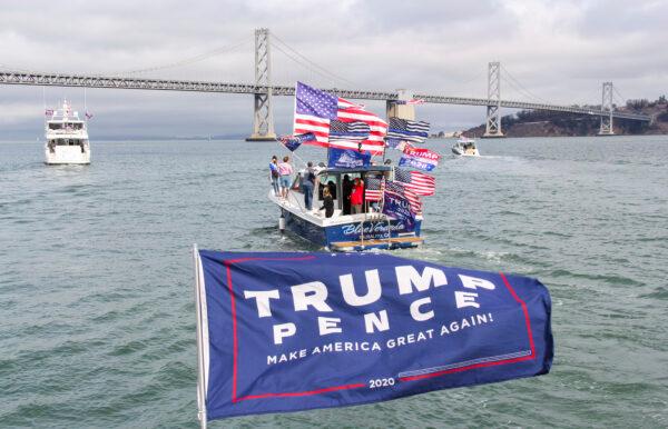 The Trump boat parade passes under the Bay Bridge in San Francisco on Oct. 10., 2020. (David Lam/The Epoch Times)