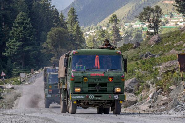 An Indian army convoy moves on the Srinagar- Ladakh highway at Gagangeer, northeast of Srinagar, Indian-controlled Kashmir, Wednesday, Sept. 9, 2020. India’s defense minister said Thursday, Sept. 17, the country faces challenges in its border dispute with China and urged Beijing to sincerely implement an understanding they reached previously to completely disengage forces in the Ladakh region. (AP Photo/ Dar Yasin)