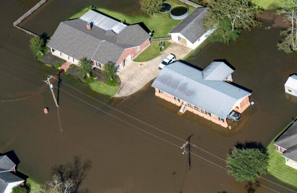 Houses surrounded by flood waters are seen in the aftermath of Hurricane Delta Saturday, in Welsh, La., on Oct. 10, 2020. (Bill Feig/The Advocate via AP)