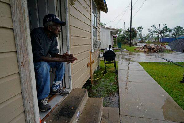 Ernest Jack, whose home was severely damaged from Hurricane Laura, sits in his front doorway as he waits for the arrival of Hurricane Delta expected to make landfall later in the day in Lake Charles, La., on Oct. 9, 2020. (Gerald Herbert/AP Photo)