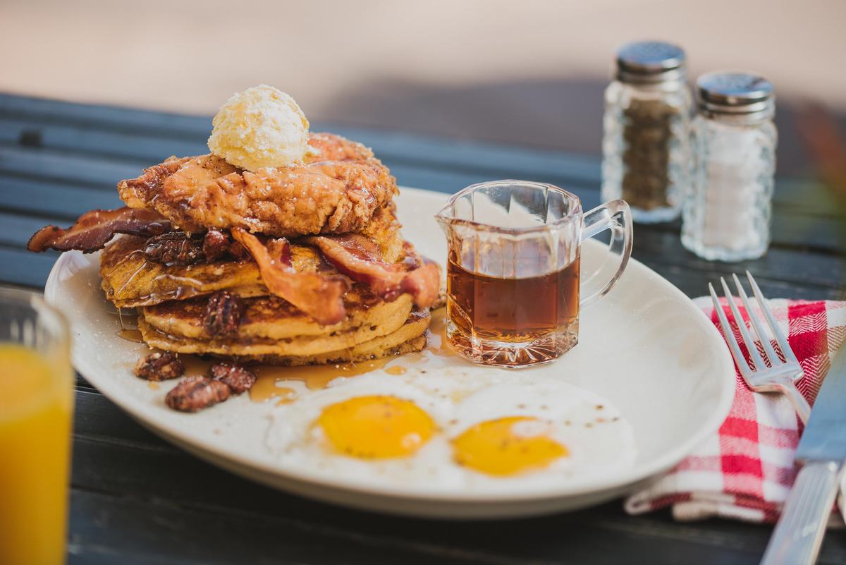 Tupelo Honey Cafe's Shoo Mercy Sweet Potato Pancakes, with buttermilk fried chicken. (Courtesy of Tupelo Honey Cafe)