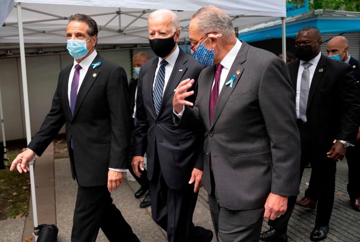 Democratic presidential nominee Joe Biden, with New York Gov. Andrew Cuomo, left, and Senate Minority Leader Chuck Schumer (D-N.Y.), arrives at the 9/11 Memorial in New York on Sept. 11, 2020. (Jim Watson/AFP via Getty Images)