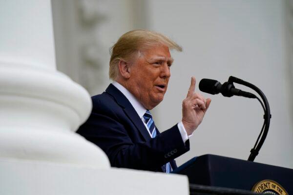 President Donald Trump speaks from the Blue Room Balcony of the White House to a crowd of supporters on Oct. 10, 2020. (Alex Brandon/AP Photo)