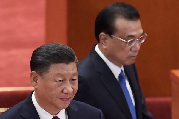 Chinese leader Xi Jinping and Premier Li Keqiang arrive in the Great Hall of the People for a ceremony to honor people who fought against the COVID-19 pandemic in Beijing, China on Sept. 8, 2020. (Nicolas Asfouri/AFP via Getty Images)