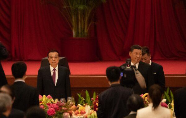 Chinese leader Xi Jinping and Premier Li Keqiang arrive at the National Day Reception in Beijing, China on Sept. 30, 2020. (Andrea Verdelli/Getty Images)