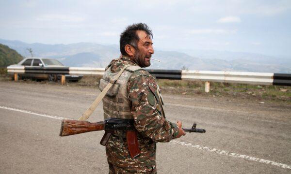 Nagorno-Karabakh militia soldier Kamo Naira holds his Kalashnikov during a military conflict near Hadrut, the separatist region of Nagorno-Karabakh, on Oct. 10, 2020. (AP Photo)