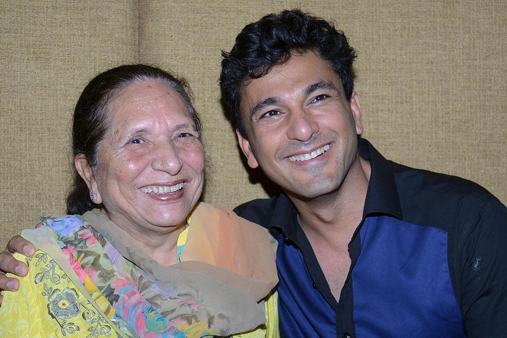 Vikas Khanna with his mother, Bindu, during a promotional event for the forthcoming MasterChef India Season 5 in Amritsar on Sept. 7, 2016. (NARINDER NANU/AFP via Getty Images)