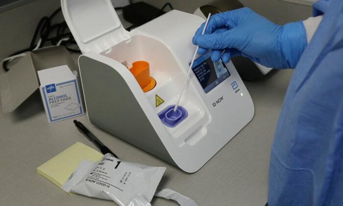 ID NOW Rapid COVID Test to Arrive This Week Amid Backlog of Unprocessed Tests