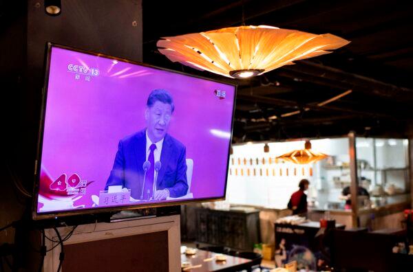 A television screen at a restaurant in Beijing shows Chinese leader Xi Jinping speaking during a broadcast from Shenzhen, at an event marking the 40th anniversary of the establishment of the Shenzhen Special Economic Zone on Oct. 14, 2020. (Noel Celis/AFP via Getty Images)