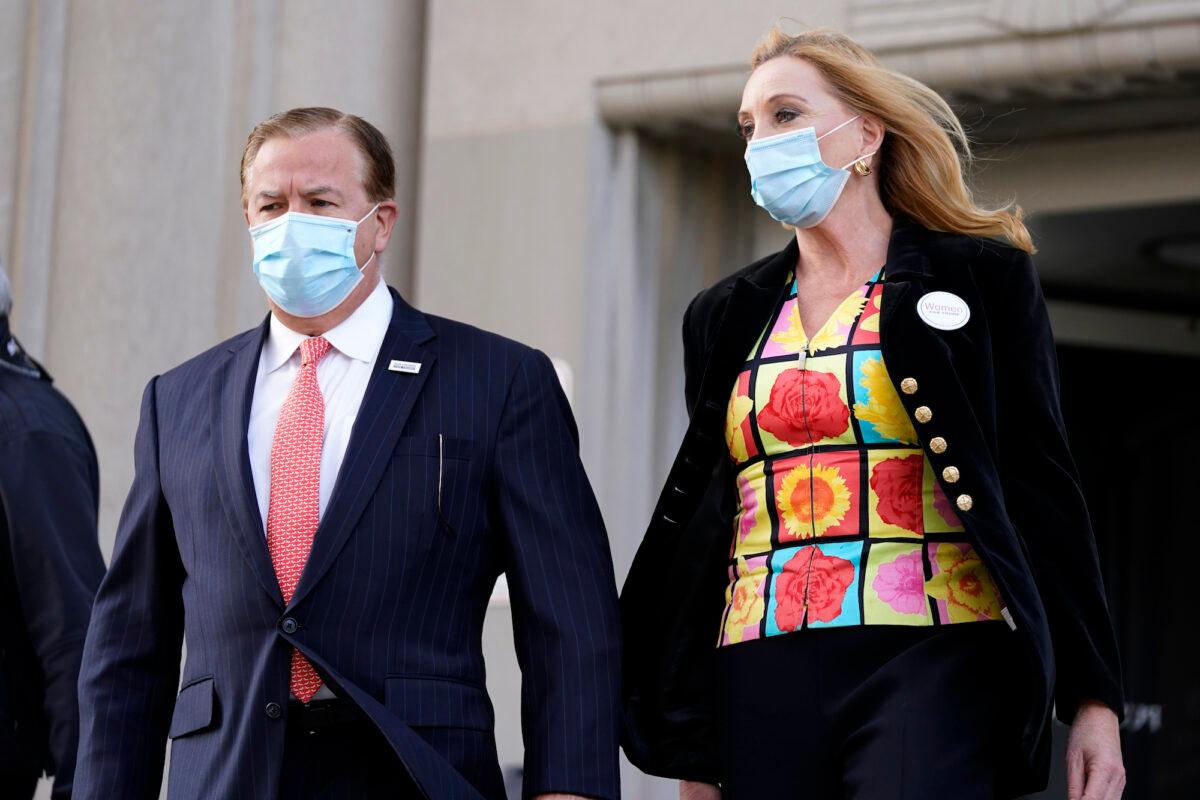 Mark and Patricia McCloskey leave following a court hearing in St. Louis, Mo., on Oct. 14, 2020. (Jeff Roberson/AP Photo)
