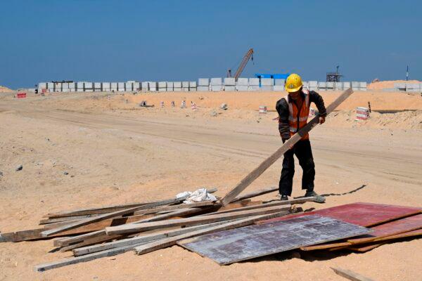 <span style="color: #000000;">A Chinese laborer works at a construction site on reclaimed land, part of a Chinese-funded project for the Port City in Colombo, Sri Lanka, on Feb. 24, 2020. (Ishara S. Kodikara/AFP via Getty Images)</span>
