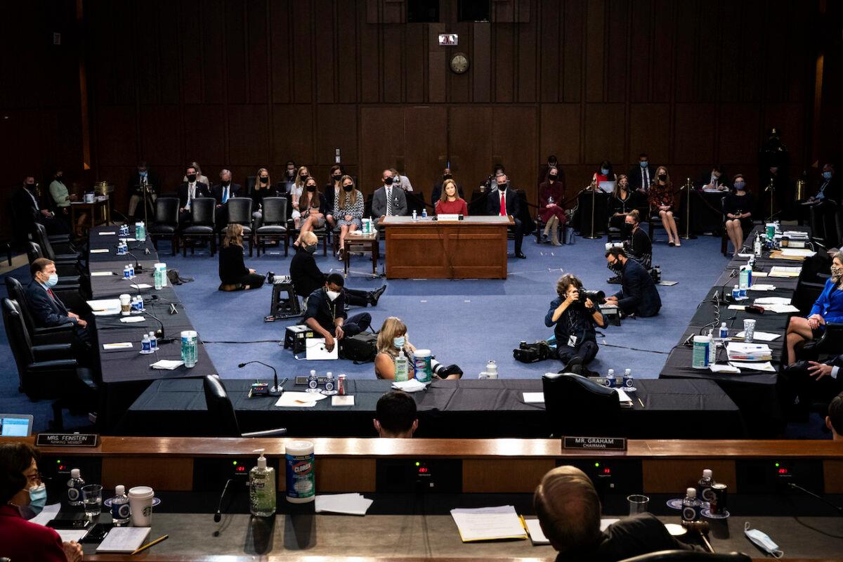 Supreme Court nominee Amy Coney Barrett listens during a confirmation hearing before the Senate Judiciary Committee, on Capitol Hill in Washington, Oct. 13, 2020. (Erin Schaff/The New York Times via AP, Pool)